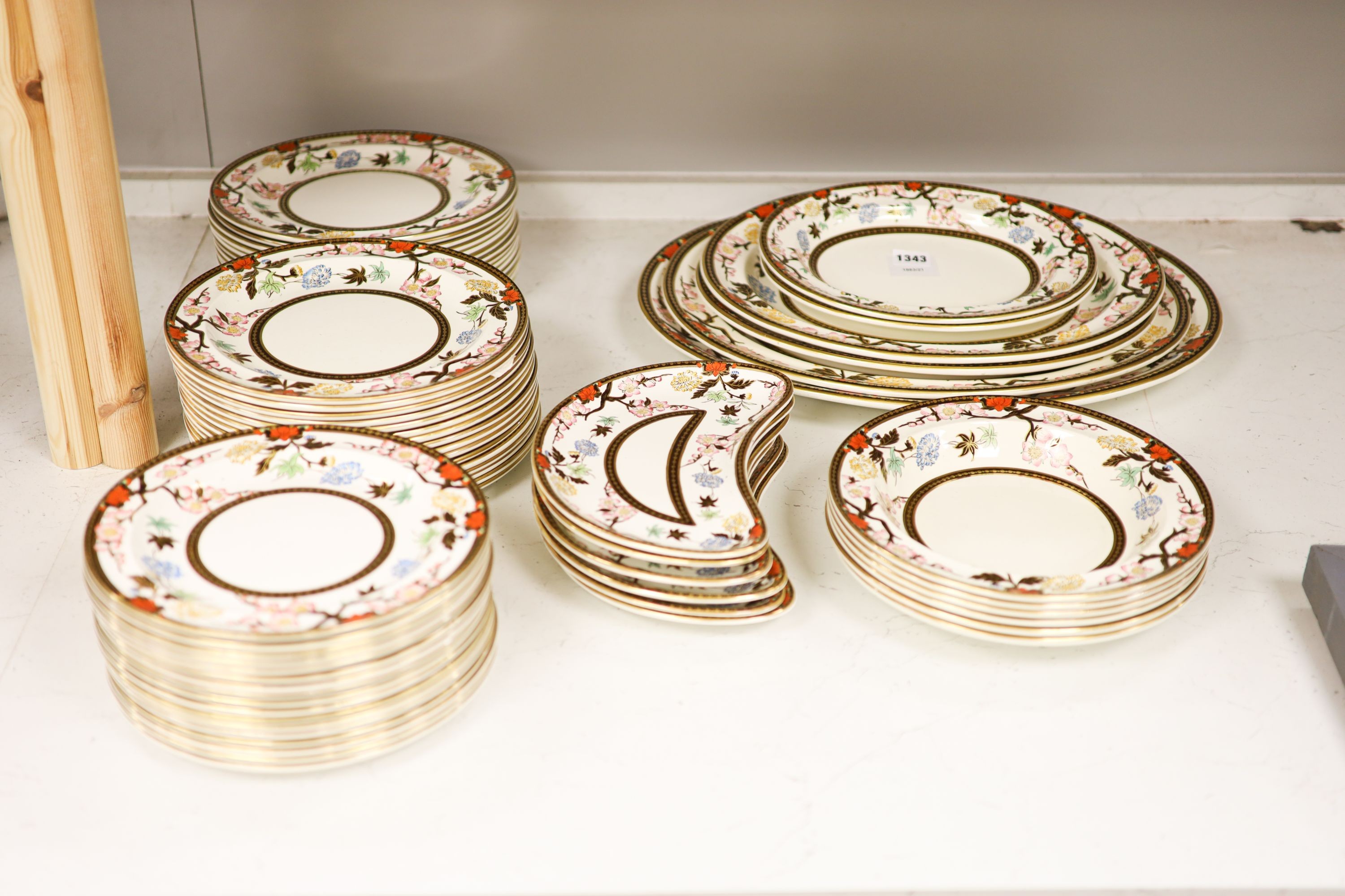 A Wedgwood Crescent pattern creamware part dinner service, the borders decorated with pink blossoms and chrysanthemums (approx. 65 pieces)